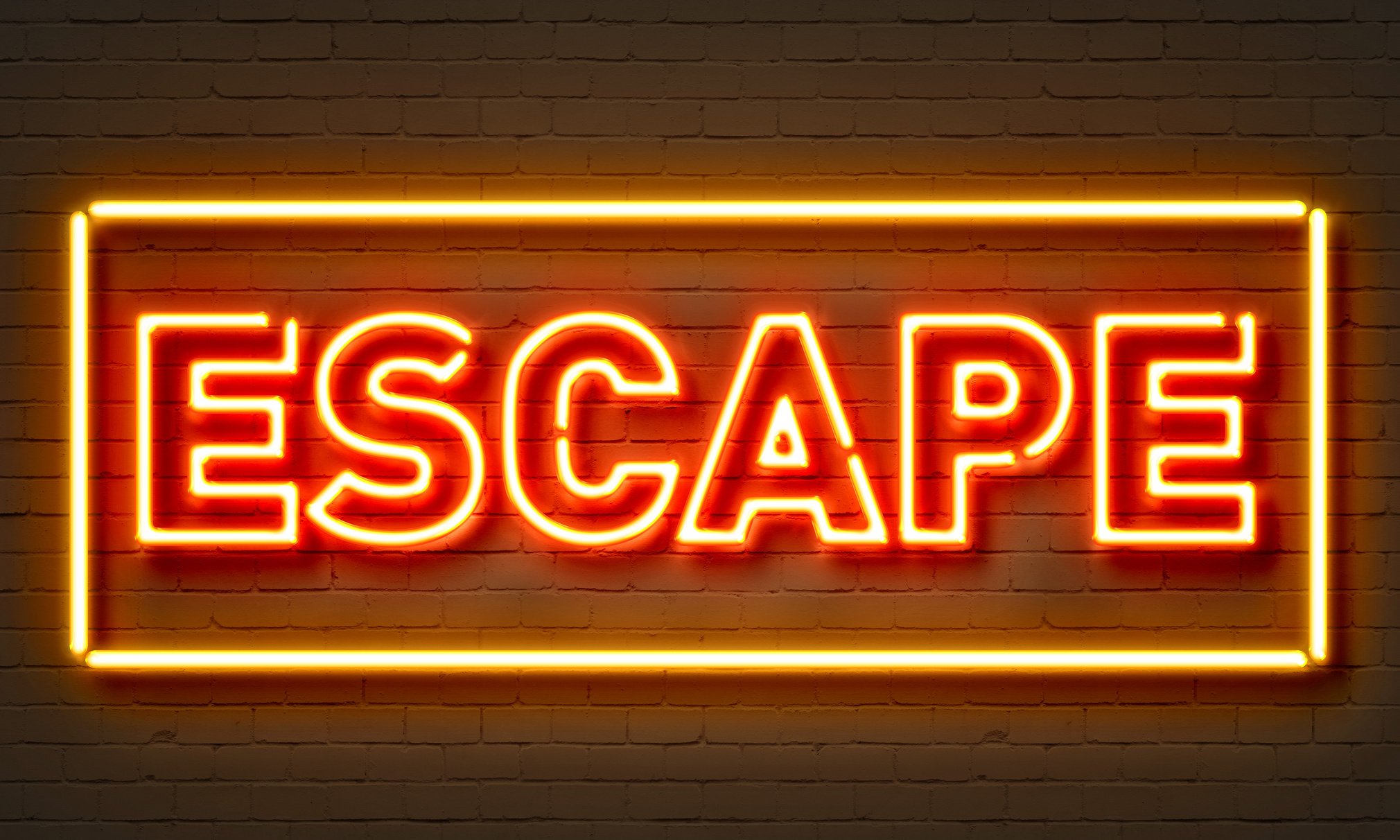 Escape Neon Sign on Brick Wall Background.